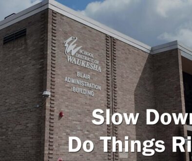 A photo of SDW district office with the text Slow Down. Do Things Right.