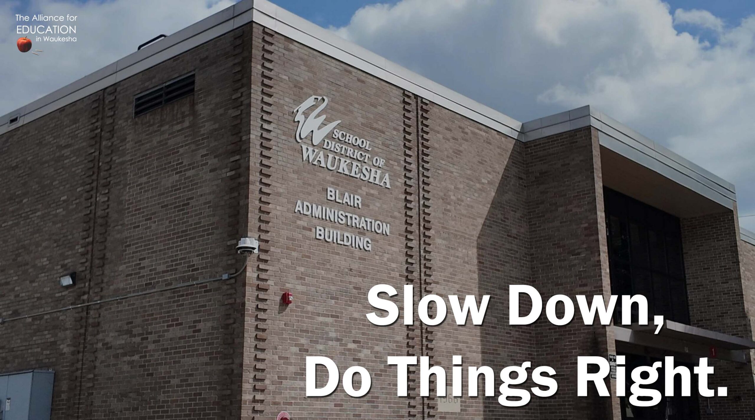 A photo of SDW district office with the text Slow Down. Do Things Right.